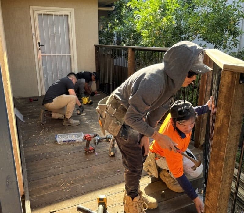 BuildBros crew installing deck balustrade