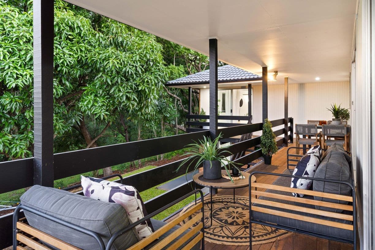 Covered timber deck looking out to gum trees