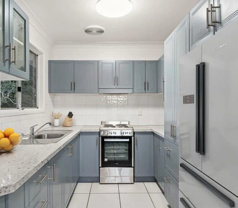 Blue-grey shaker kitchen at Tingatel Street